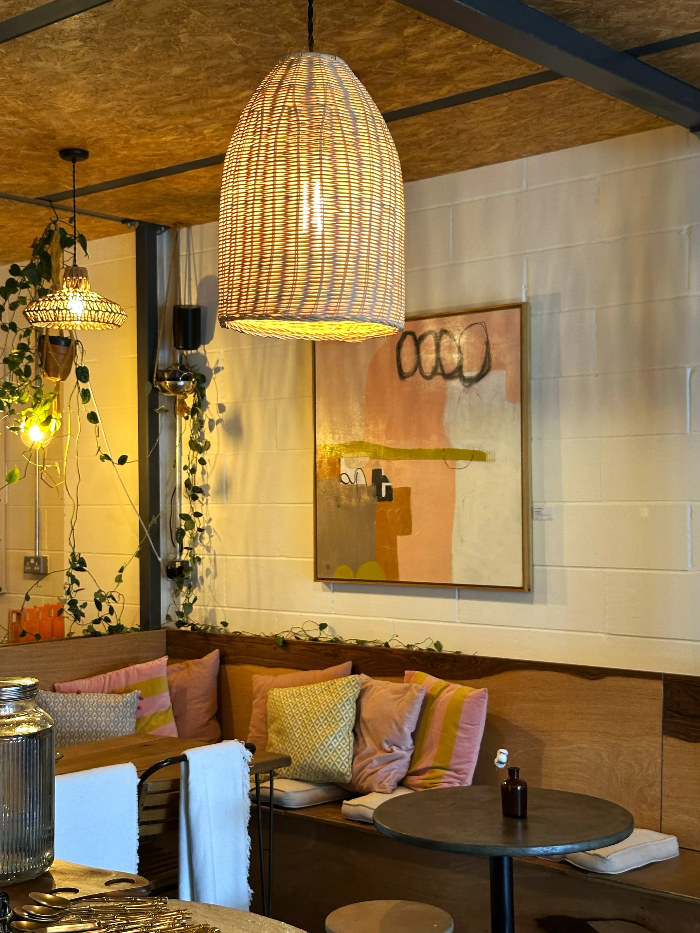 Warm Prana House seating with woven pendant lights
