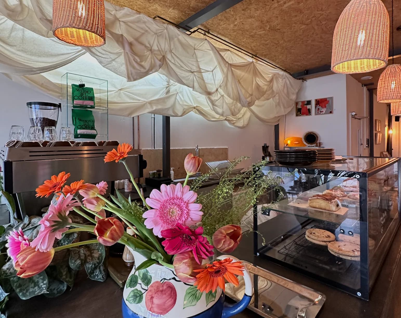 Prana House counter with flowers, coffee, and pastries